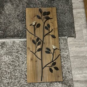 Hangs on the wall nicely held up by wire on the back in great shape!